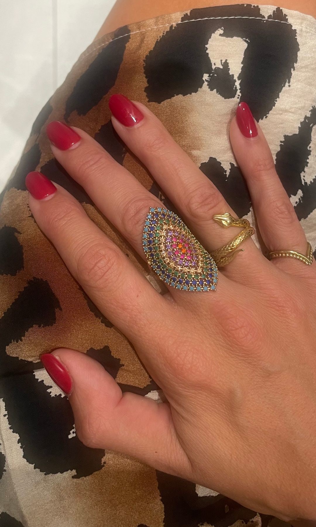 Becci's hands with fake red nails 