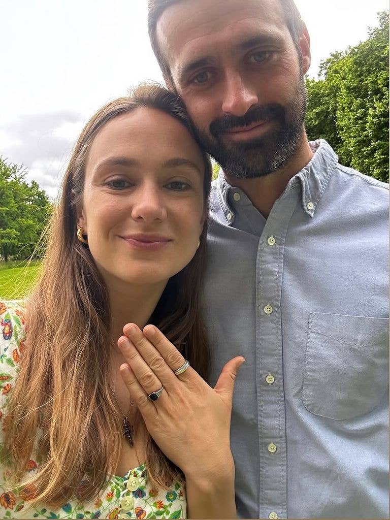 man and woman with engagement ring