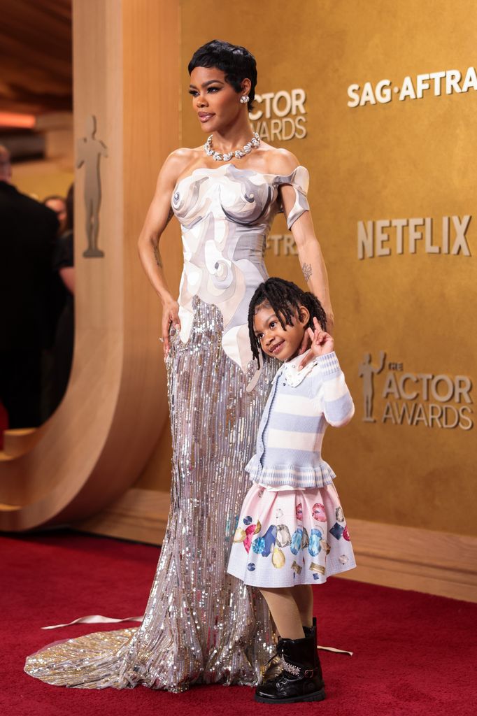 Teyana Taylor and her daughter Rue Rose pose for the cameras