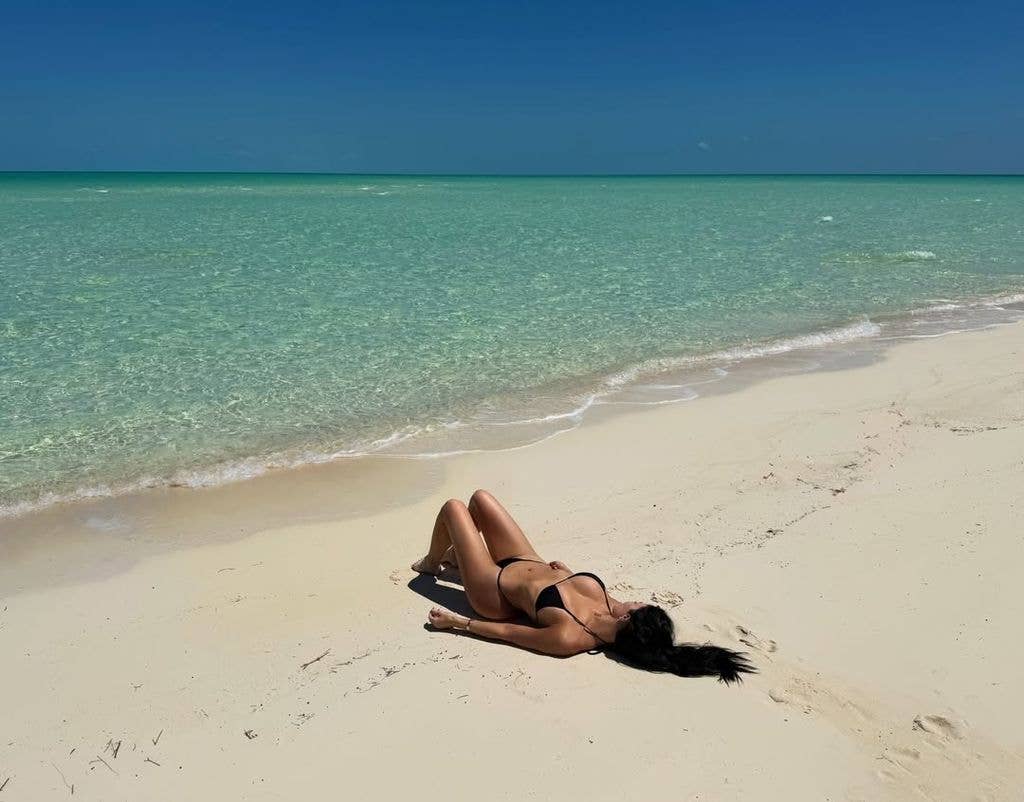 Kylie enjoyed down time on the deserted beach