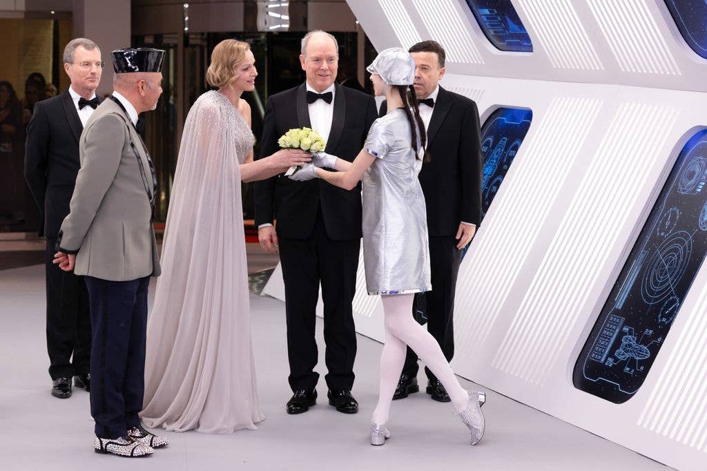 Princess Charlene handed flowers by one of the evening's performers