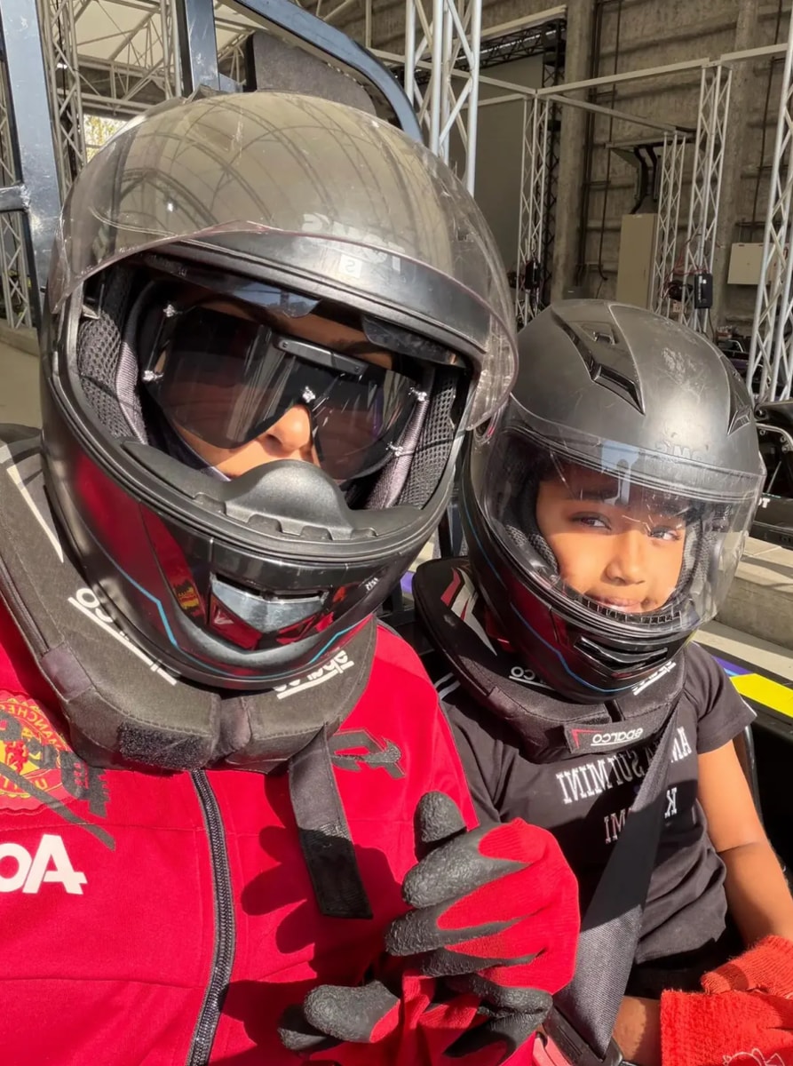 Kim Kardashian stepped into the fast lane, donning a bold red racing suit paired with a sleek black helmet