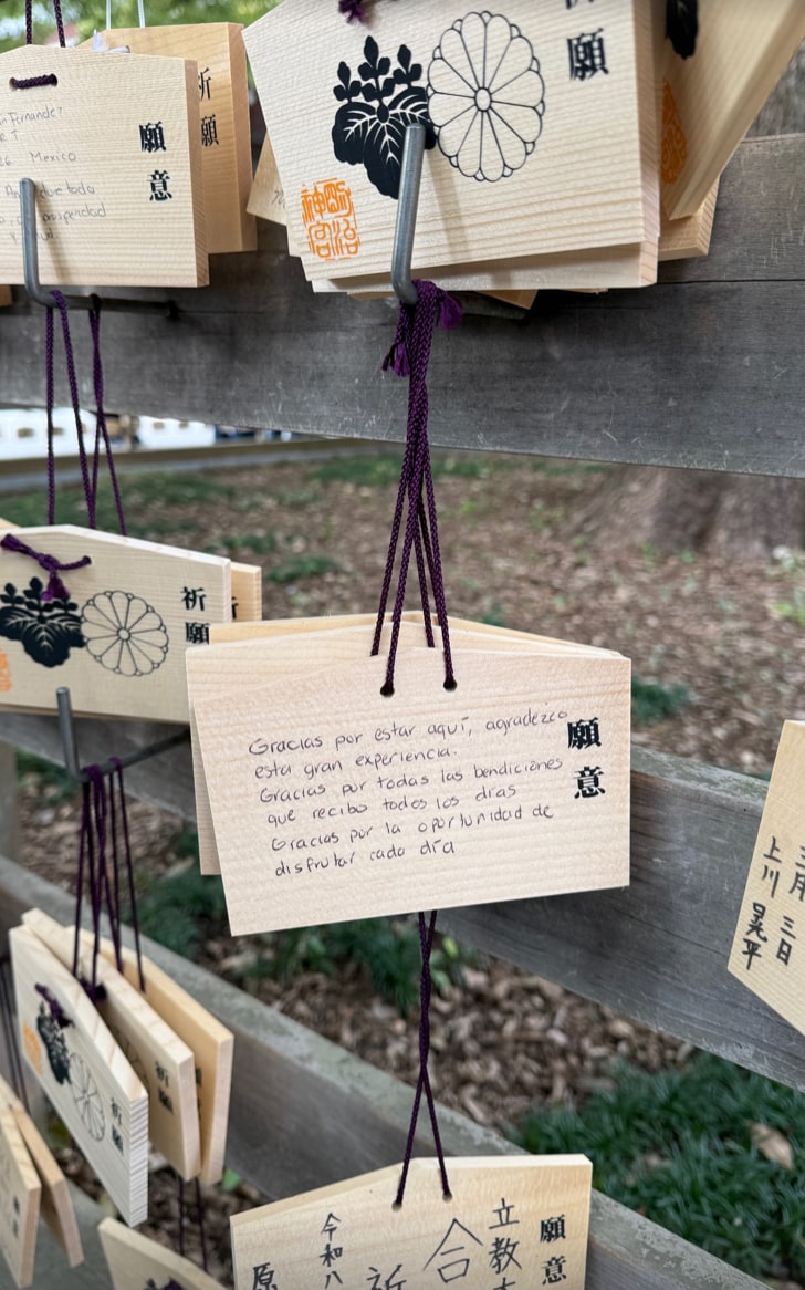 Beyond the fashion moments, Berlingeri also shared glimpses of her cultural experience in Tokyo, including a photo of traditional wooden prayer plaques known as ema at a shrine. 