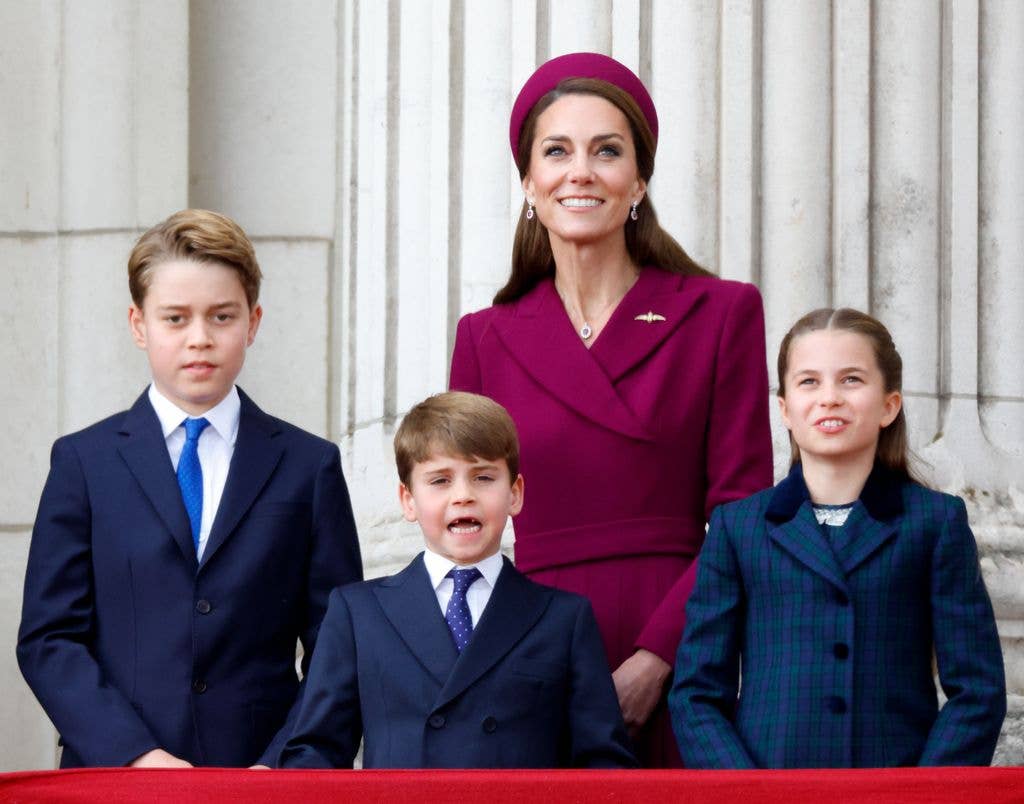 Prince George of Wales, Prince Louis of Wales, Catherine, Princess of Wales and Princess Charlotte of Wales watch a flypast from the balcony of Buckingham Palace