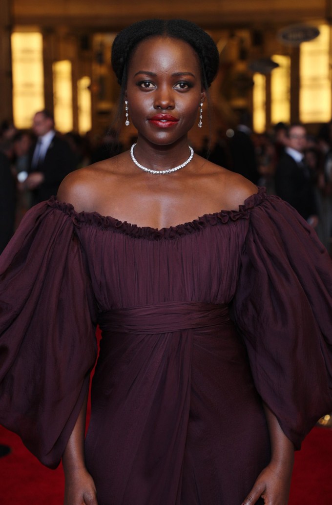 Lupita Nyong’o Wearing A Purple Dress