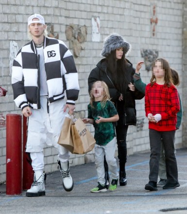 Malibu, CA  - *EXCLUSIVE* Machine Gun Kelly and Megan Fox take her kids and her mother Gloria Darlene Fox Christmas shopping at One Gun Ranch store at The Malibu Pier in Malibu.Pictured: Machine Gun Kelly, Megan FoxBACKGRID USA 21 DECEMBER 2022 BYLINE MUST READ: RMBI / BACKGRIDUSA: +1 310 798 9111 / usasales@backgrid.comUK: +44 208 344 2007 / uksales@backgrid.com*UK Clients - Pictures Containing ChildrenPlease Pixelate Face Prior To Publication*