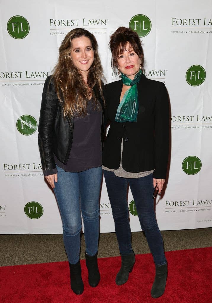 Mary McDonnell stands with her arm around daughter Olivia Mell on the red carpet at Witness: The John Edgar Wideman Experience in 2018.