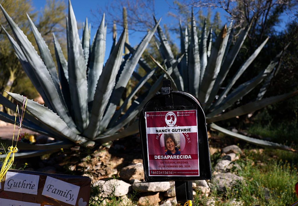 A picture of Nancy Guthrie is displayed on a mailbox in front of her home on February 27, 2026, in Tucson, Arizona