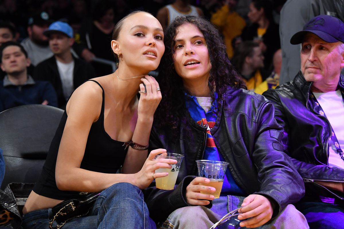 Lily-Rose Depp (L) and musician 070 Shake attend a basketball game between the Los Angeles Lakers and the Minnesota Timberwolves at Crypto.com Arena on March 10, 2024 in Los Angeles, California. NOTE TO USER: User expressly acknowledges and agrees that, by downloading and or using this photograph, User is consenting to the terms and conditions of the Getty Images License Agreement. (Photo by Allen Berezovsky/Getty Images)