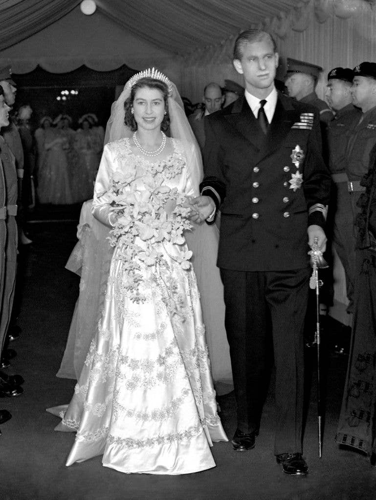 Queen Elizabeth II and her husband Prince Philip, Duke of Edinburgh, leave Westminster Abbey after the wedding ceremony