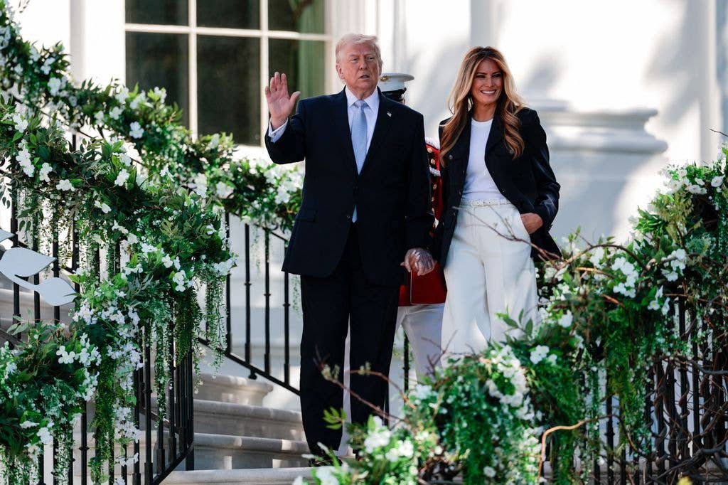 photo of donald and melania trump holding hands