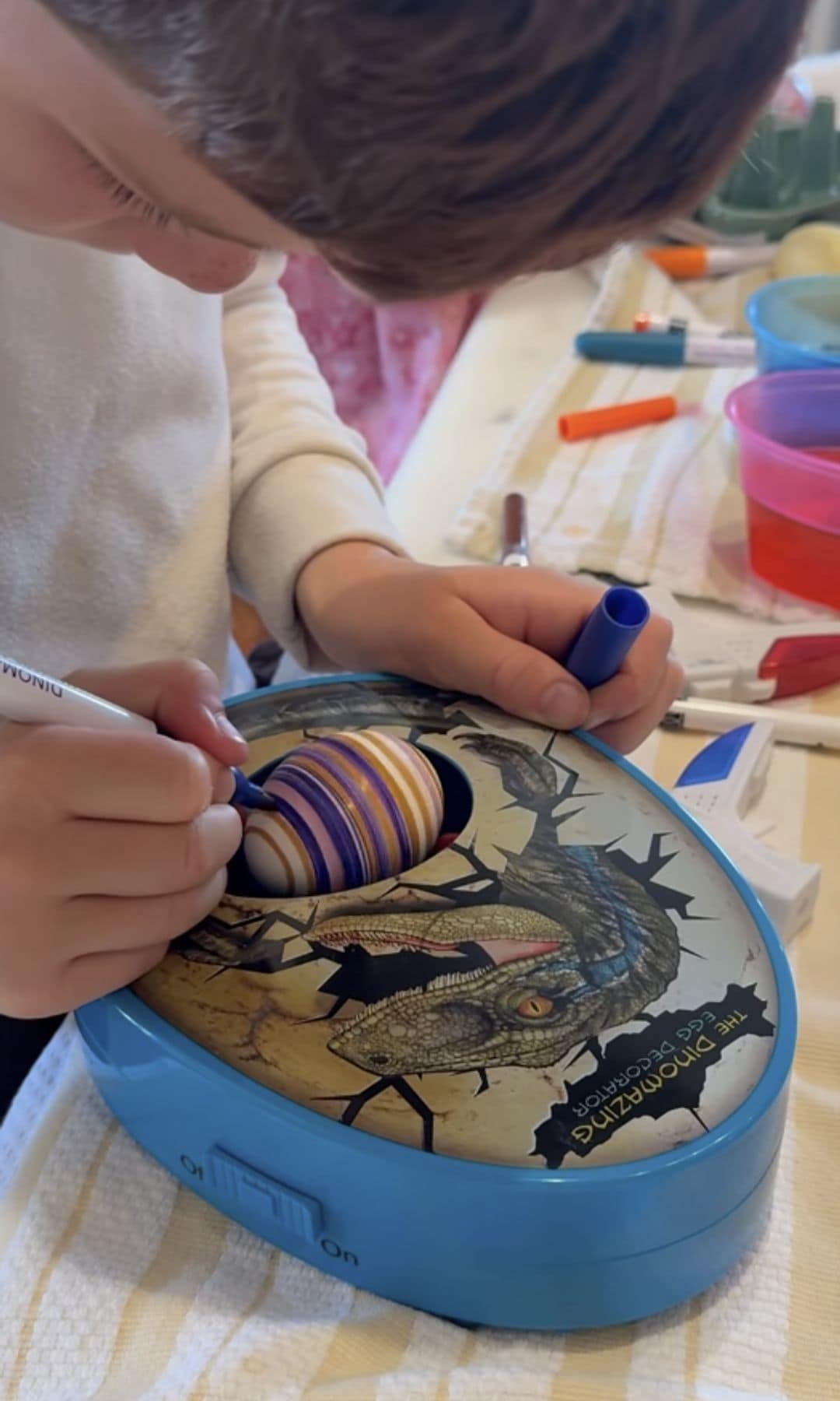 Archie decorating his Easter eggs