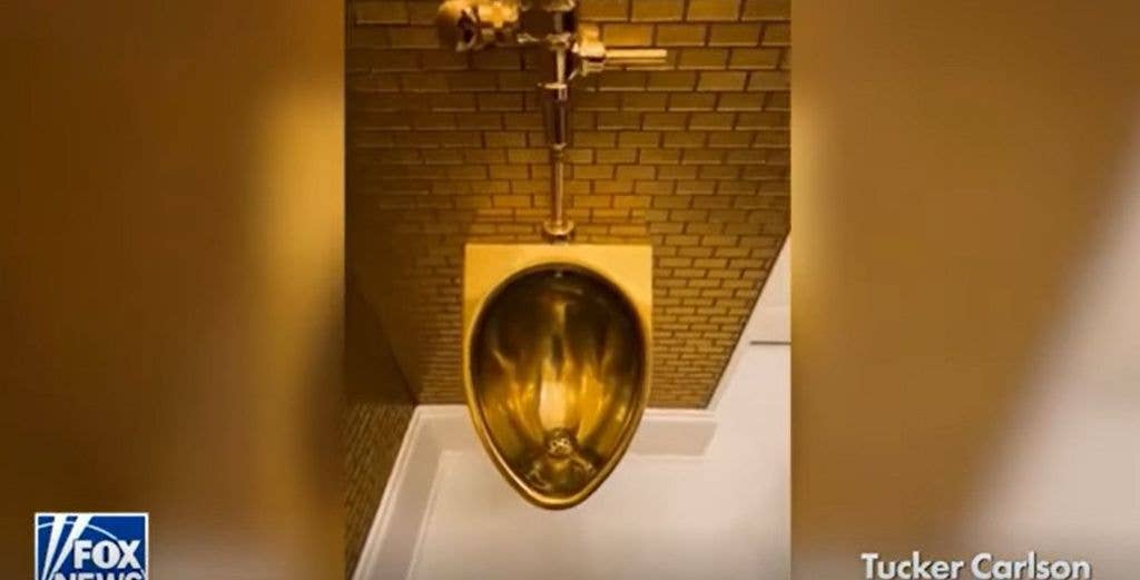 photo of gold urinal