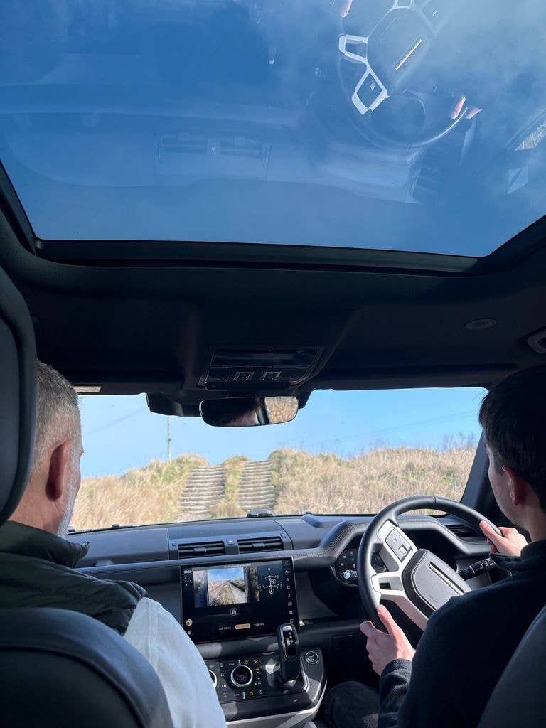 A landrover going up a steep hill