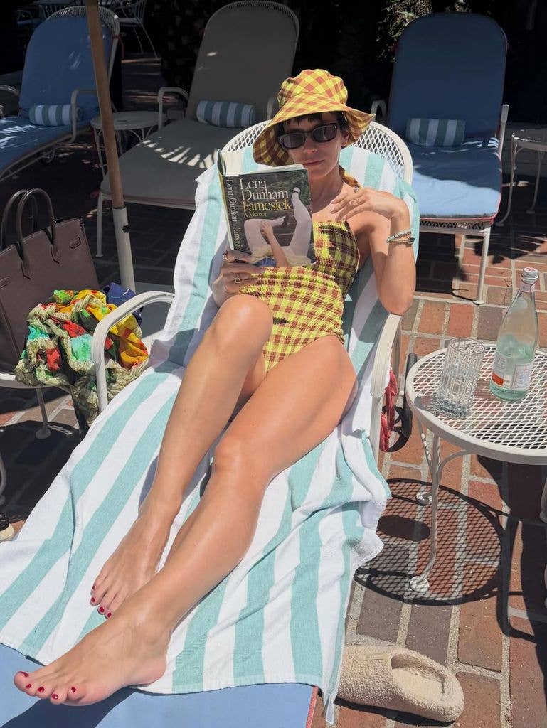 A photo of Lily Allen wearing a yellow swimsuit