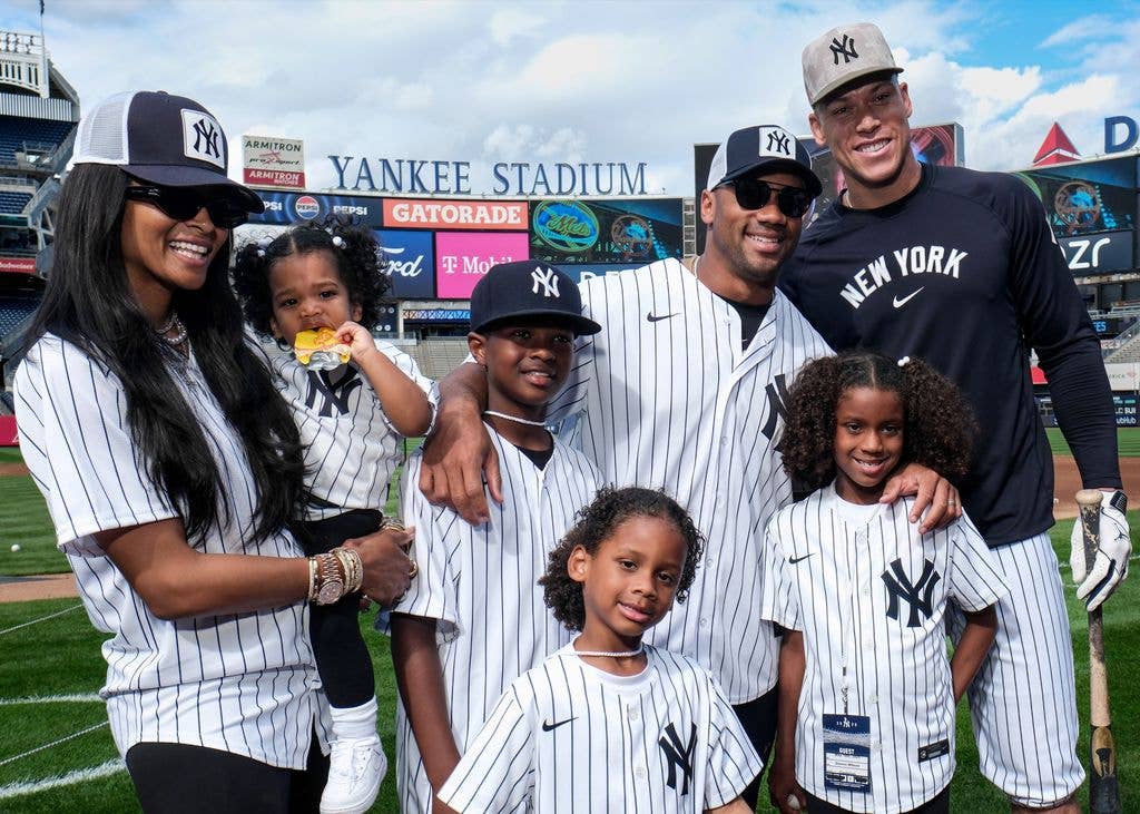 Russell Wilson, Ciara, and their family pose with Aaron Judge