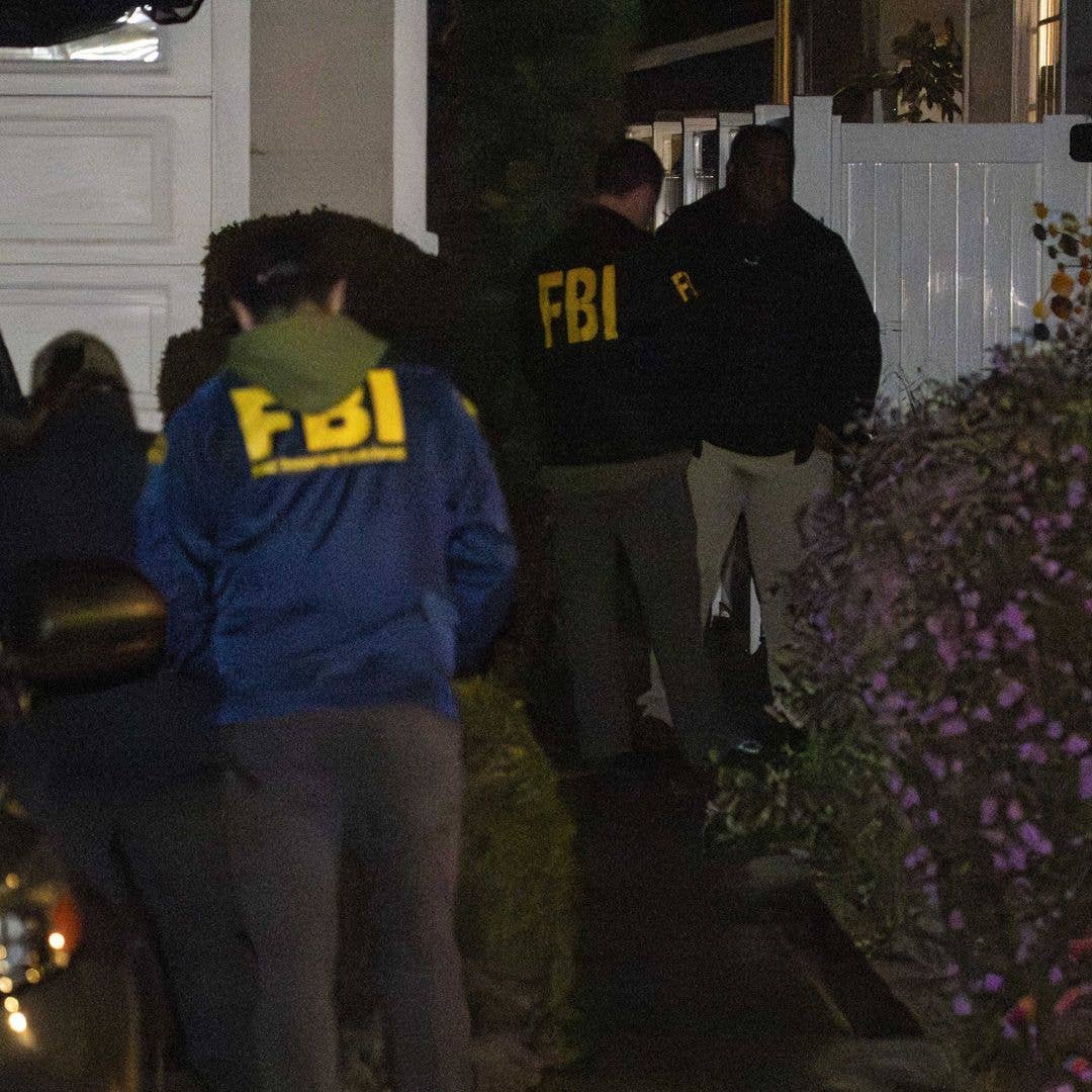 FBI agents are seen outside the residence of Cole Thomas Allen following a federal raid in Torrance, California, on April 26, 2026. The operation was conducted as part of the intensive investigation into the 31-year-old suspect, who was detained in connection with the shooting incident at the White House Correspondents' Dinner in Washington, D.C.