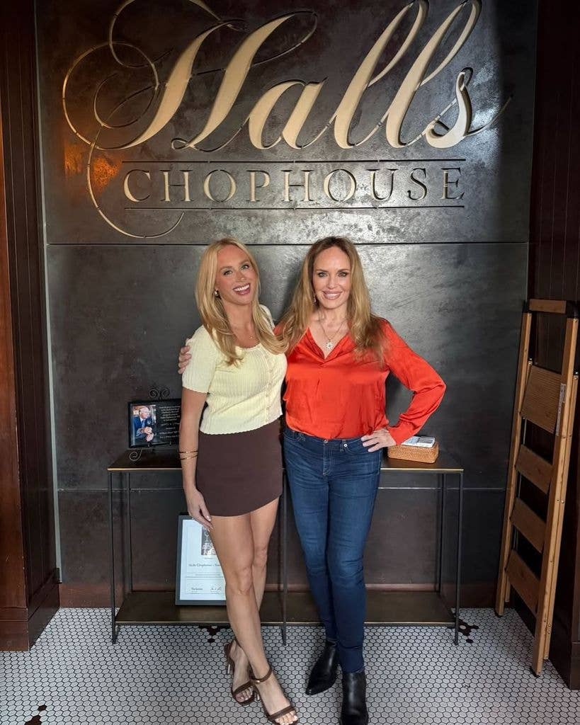 Catherine Bach (R) poses with a friend