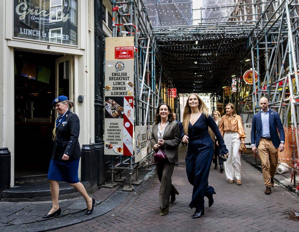 Princess Amalia of the Netherlands (C,R) walks with Amsterdam mayor Femke Halsema in Amsterdam 