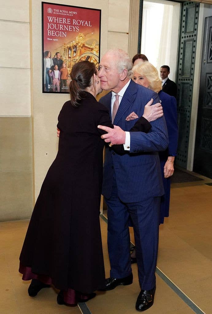 A photo of Lady Sarah Chatto and King Charles kissing on the cheek