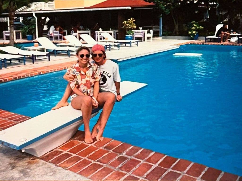 Michael J. Fox and Tracy Pollan sit on a diving board atop a swimming pool in a throwback photograph, shared on Instagram