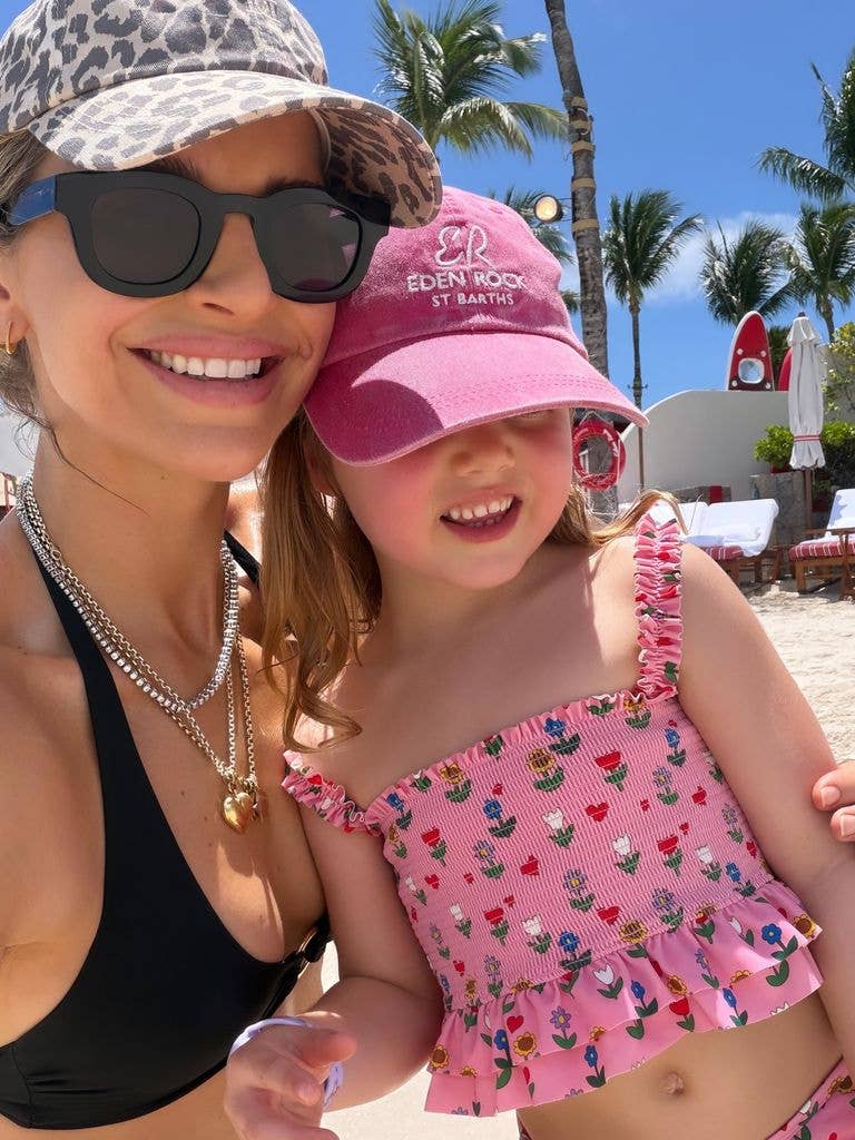 Vogue Williams in a black bikini alongside daughter Gigi
