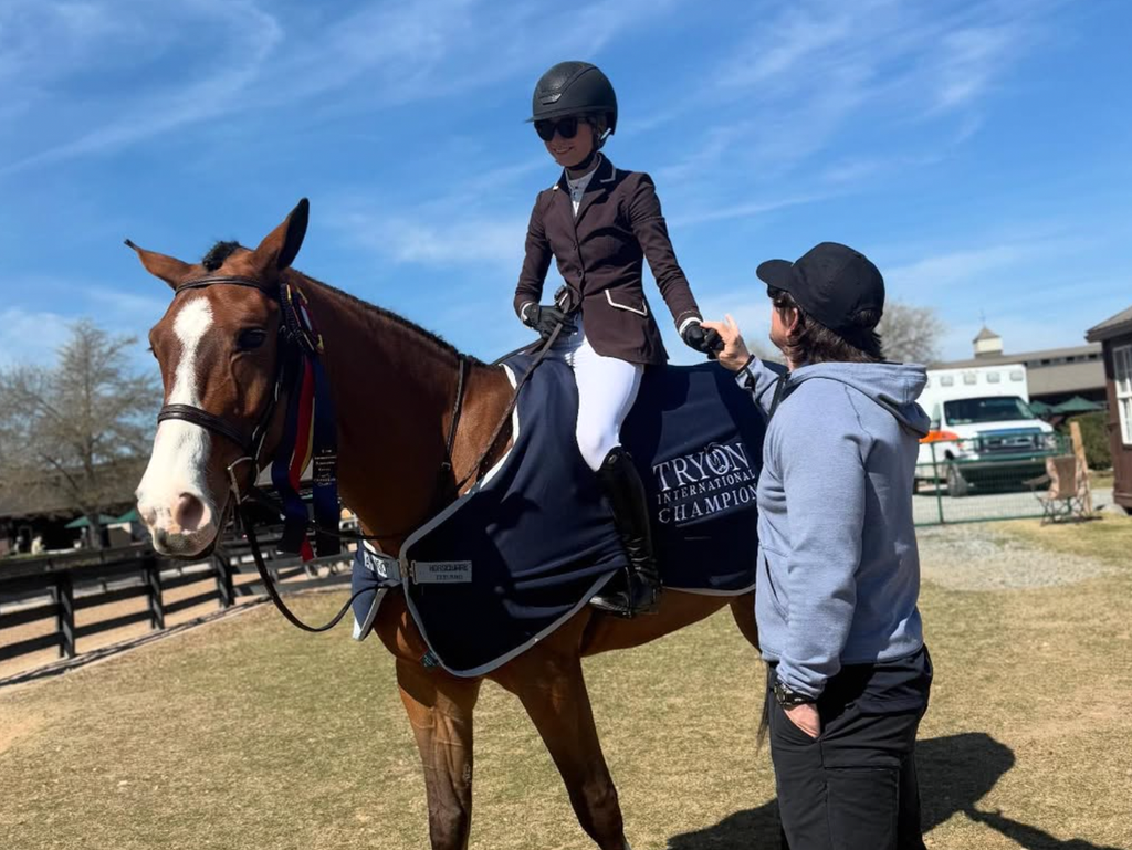 Photo shared by Mark Wahlberg's wife Rhea Durham of the actor and their daughter Grace at a horseback riding competition, March 2025