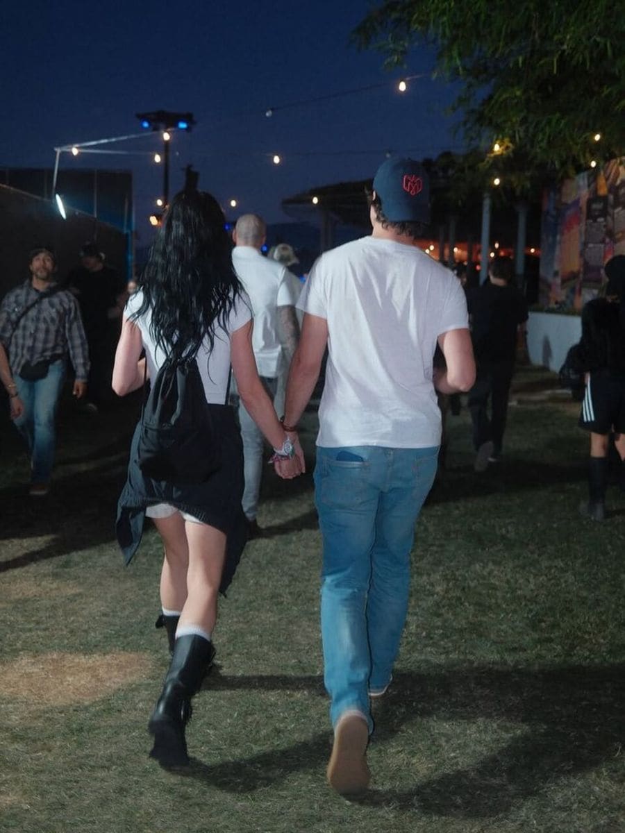 Katy Perry and Justin Trudeau at Coachella, holding hands.