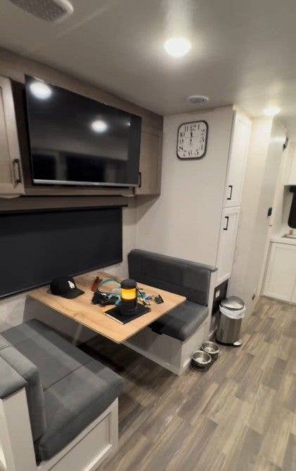 photo of table and chairs inside chet hanks trailer