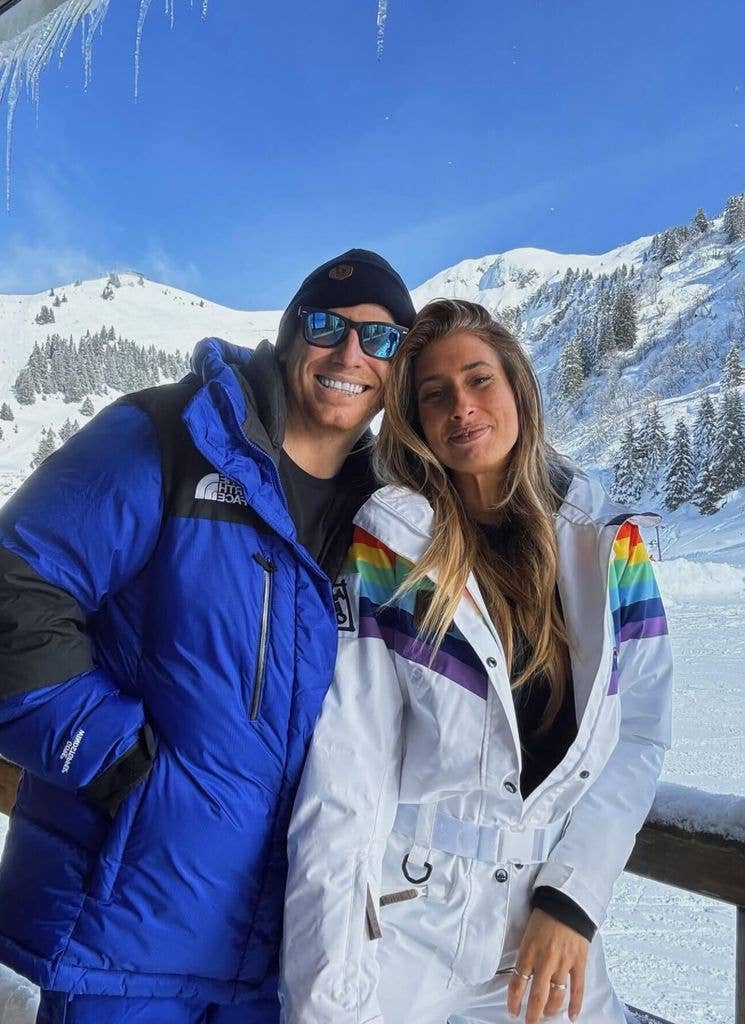 Stacey and Joe in skiwear by mountain