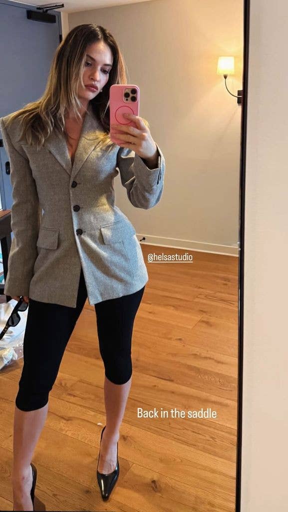 A photo of Lily James wearing a blazer and capris