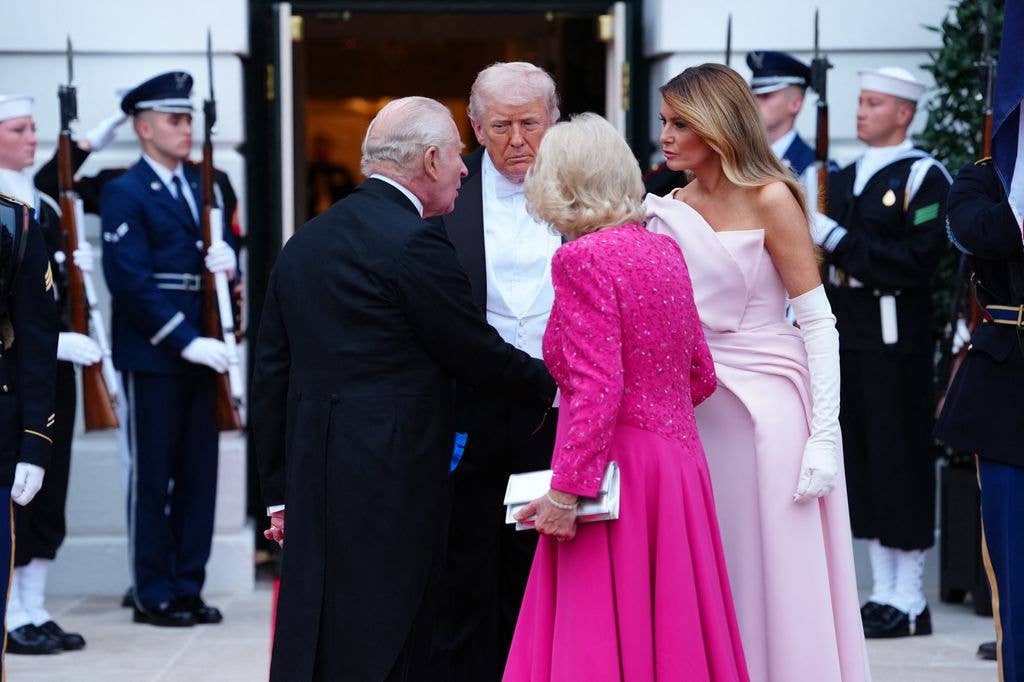 US President Donald Trump, First Lady Melania Trump, Britain's King Charles III and Queen Camilla talk before a State Dinner in the East Room of the White House in Washington, DC, on April 28, 2026. (