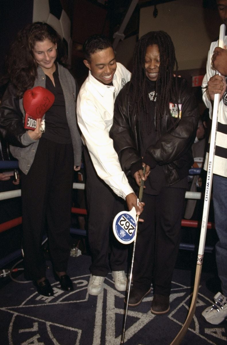 Tiger Woods and Whoopi Goldberg in 2010 at the first Annual All Star Cafe Sports Auction benefiting Special Olympics International 