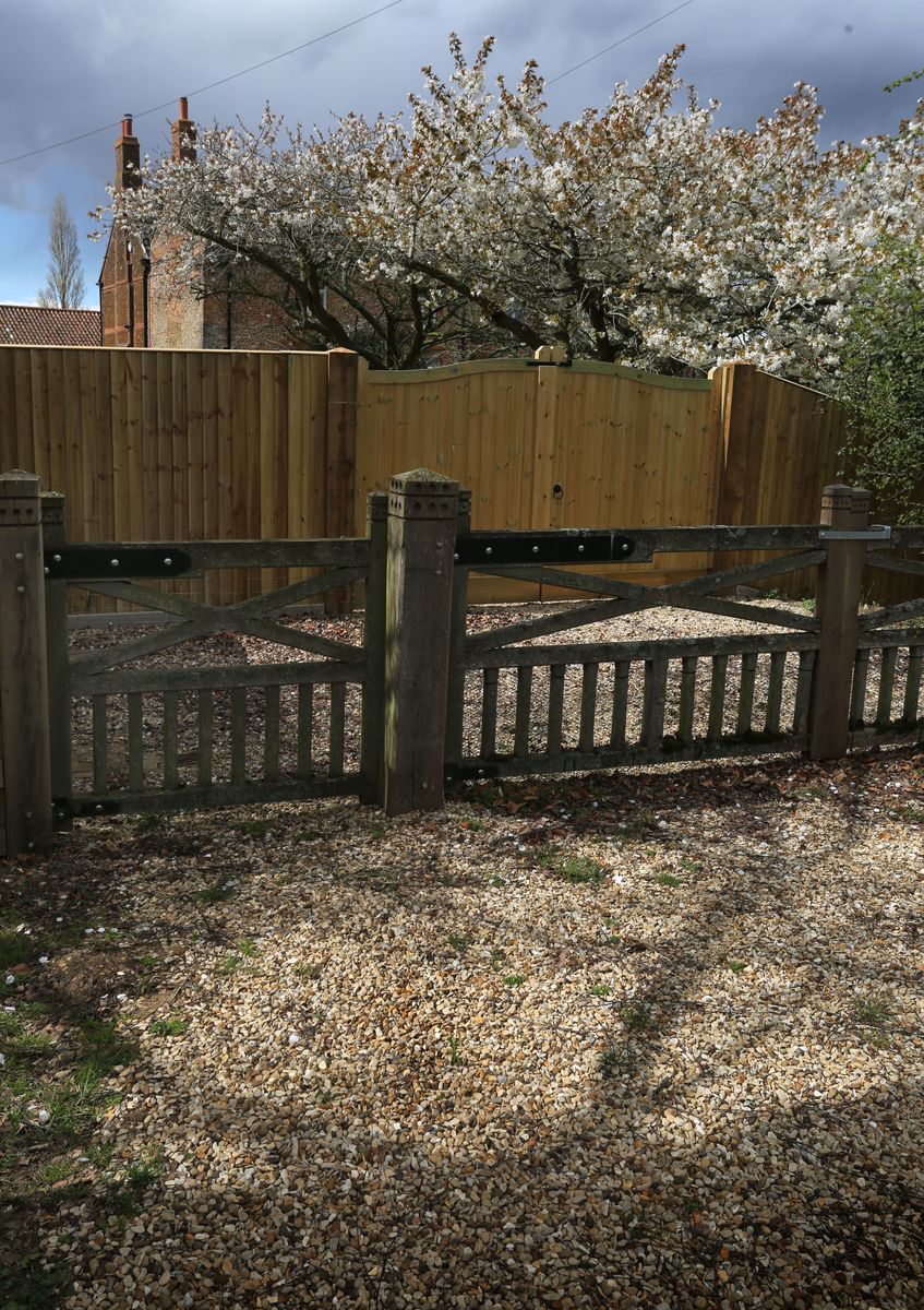 A general view of Marsh Farm showing trees in full blossom and the new wooden gates where Andrew Mountbatten-Windsor relocated from Wood Farm on the Sandringham estate on Easter Sunday, April 5, 2026.