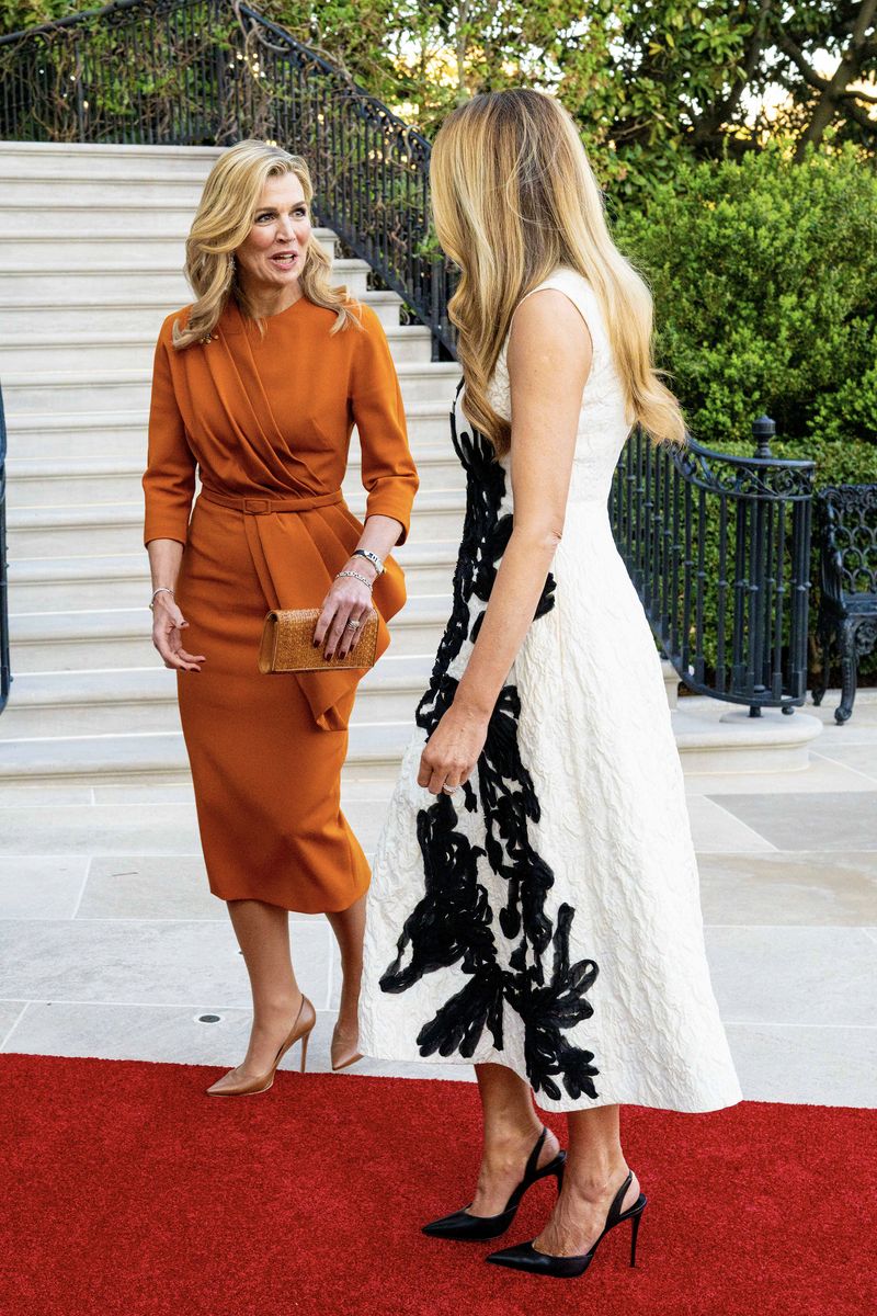 Where Máxima leaned into bold color and fluid movement, Melania opted for precision tailoring and graphic minimalism, highlighting two distinct approaches to diplomatic dressing.