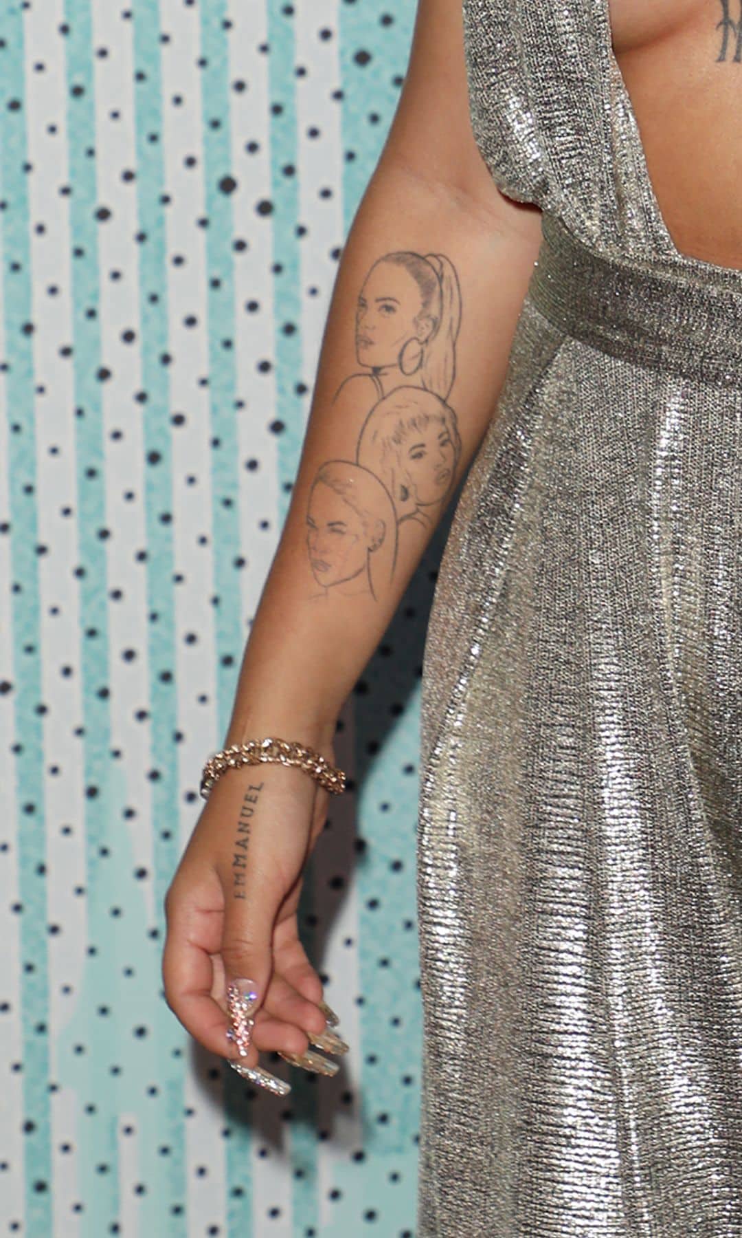 Karol G’s tattoo also pays tribute to two defining figures in her life and career.