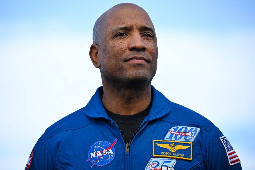 NASA astronaut and Artemis II pilot Victor Glover looks on during the rollout of NASA's next-generation moon rocket, the Space Launch System (SLS) rocket with the Orion crew capsule, to the launch pad at the Kennedy Space Center in Cape Canaveral, Florida, US, in January 17, 2026.