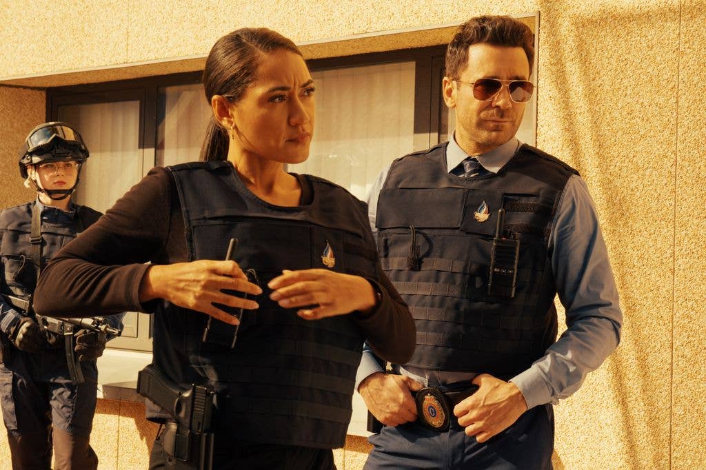 two police officers wearing gun proof vests