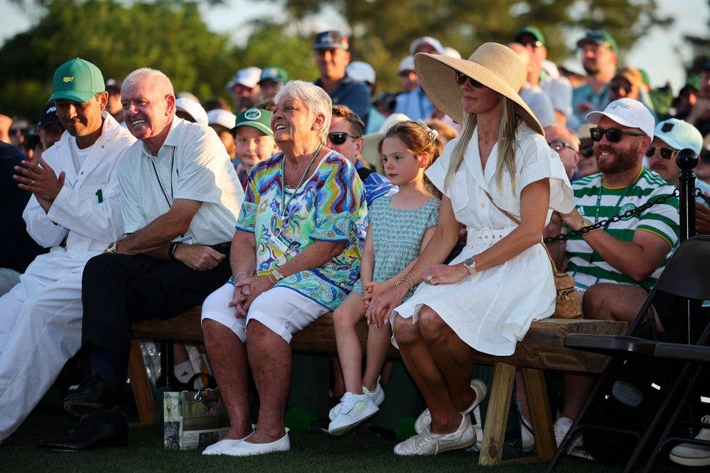 Rory's caddie Harry Diamond, father Gerry McIlroy, mother Rosie McIlroy, daughter Poppy and wife Erica Stoll watch as Rory speaks during the Green Jacket Ceremony 