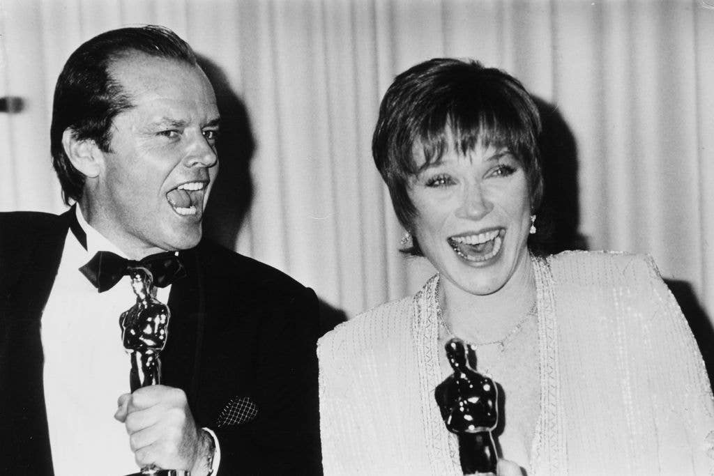 Jack Nicholson and Shirley joking around with their Oscar statuettes