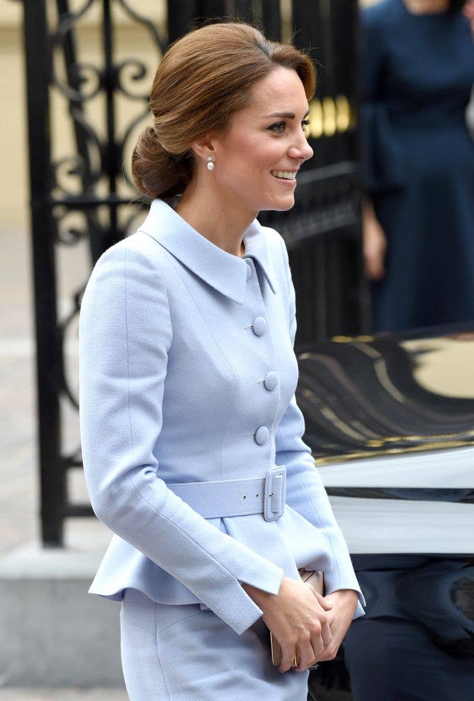 Kate side on with bouffant updo and peplum silhouette blue jacket
