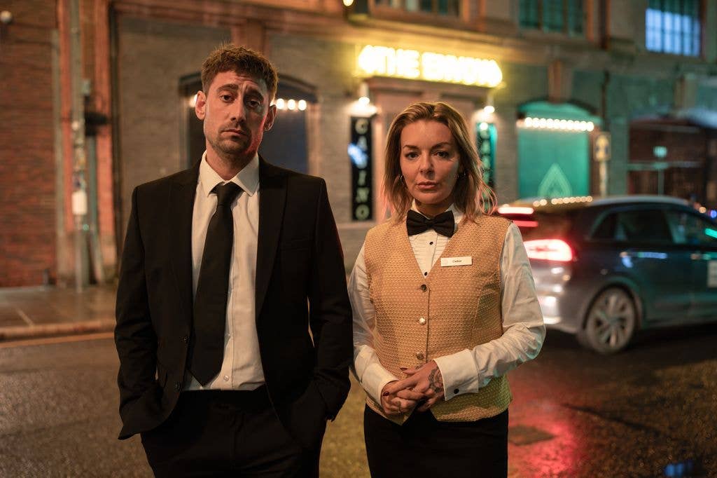 man and woman in suits outside casino
