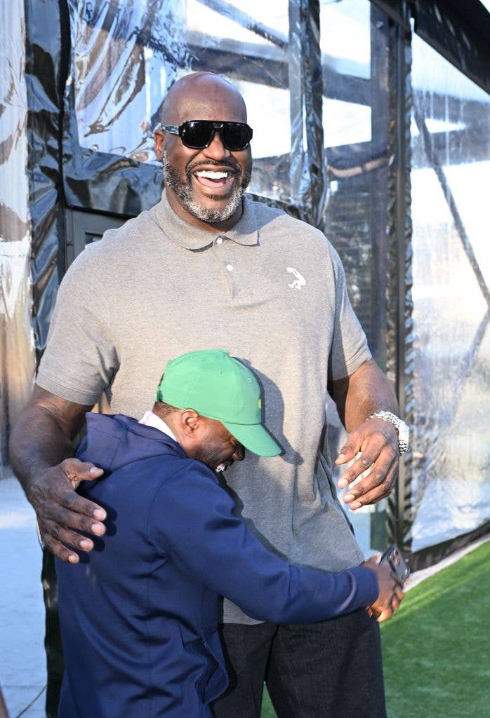 Kevin gives Shaq a big hug