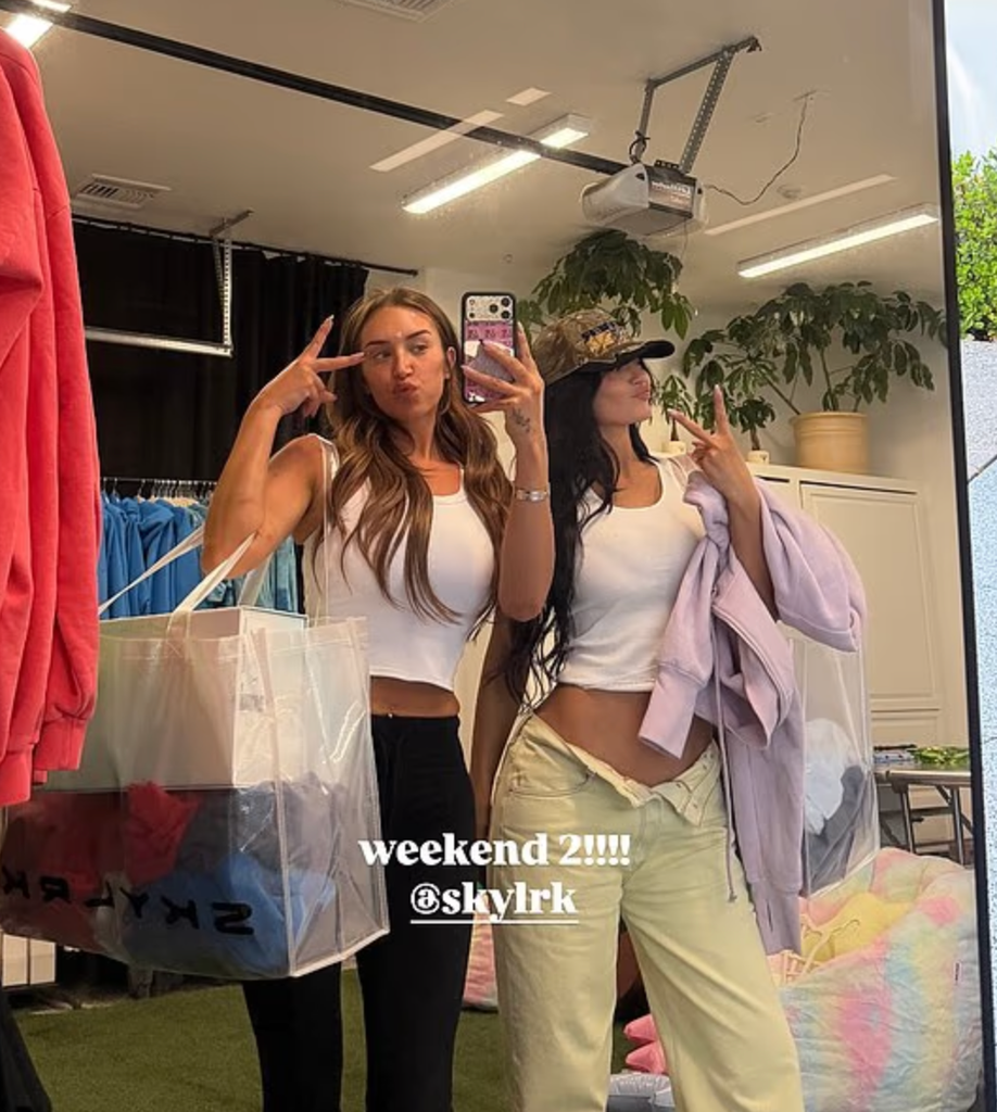 Kylie and friend give a subtle nod to a weekend that blended fashion, fun and a little retail therapy