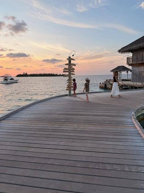 alejandra gere walking with two of her children on a dock in an Instagram photo