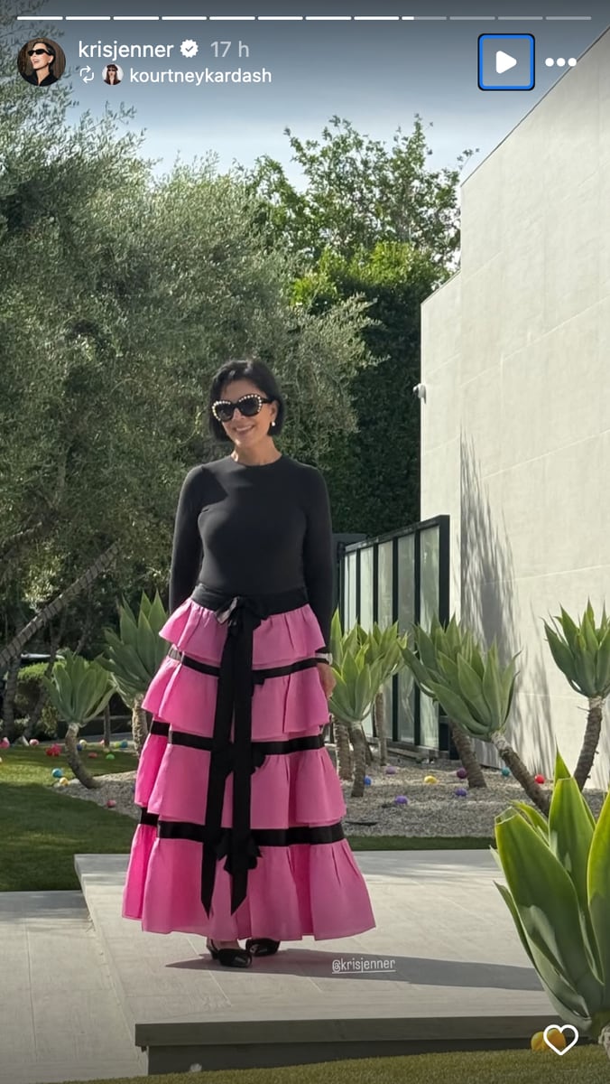 Kris Jenner leaned into soft spring tones with a pink ruffled maxi skirt paired with a black sweater