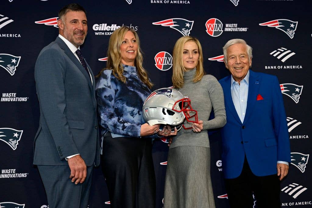 Owner Robert Kraft and his wife Dana Blumberg pose for a photograph with Mike Vrabel and his wife Jen Vrabel as Vrabel is announced as head coach of the New England Patriots during a press conference at Gillette Stadium on January 13, 2025 in Foxborough, Massachusetts