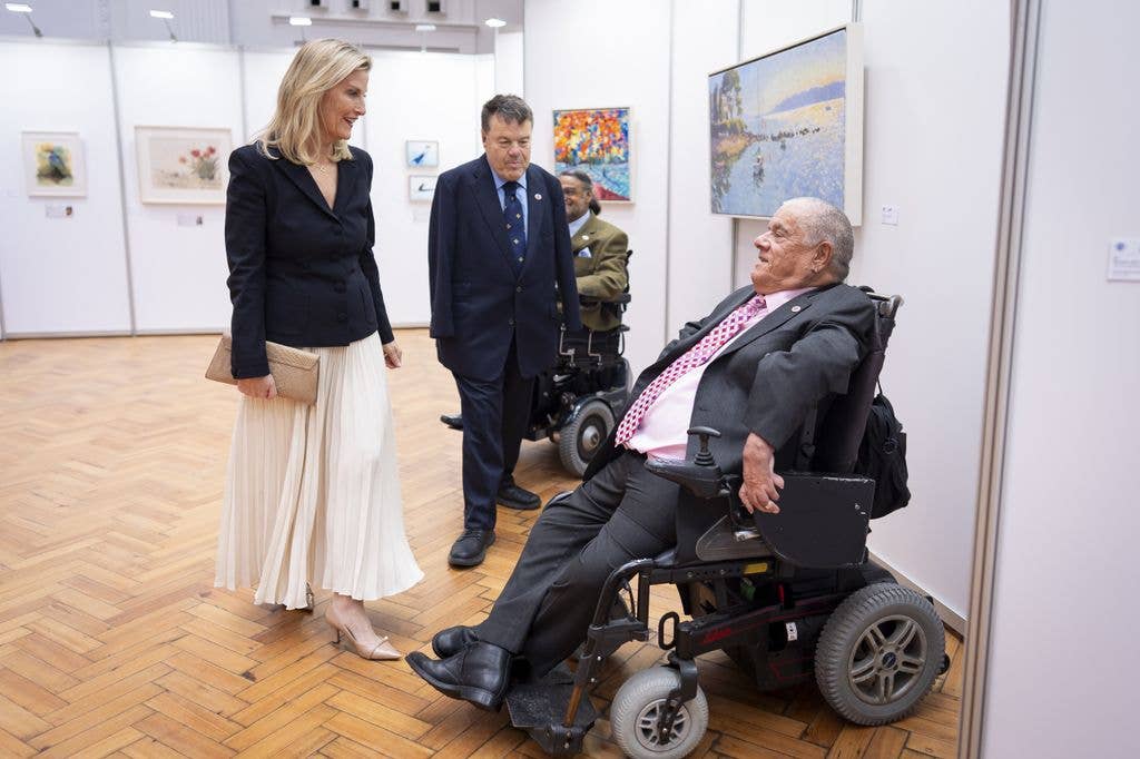 The Duchess of Edinburgh meeting an artist in a wheelchair