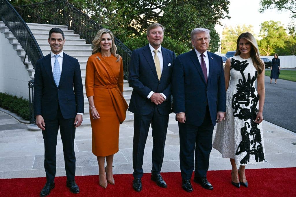 King of the Netherlands Willem-Alexander (C) and Queen Maxima (2nd-L), accompanied by the Dutch Prime Minister Rob Jetten (L), are welcomed by US President Donald Trump and First Lady Melania Trump into the White House in Washington, DC, on April 13, 2026. (Photo by Brendan SMIALOWSKI / AFP via Getty Images)