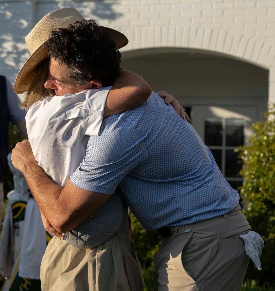Rory celebrates with his wife Erica after winning the Masters
